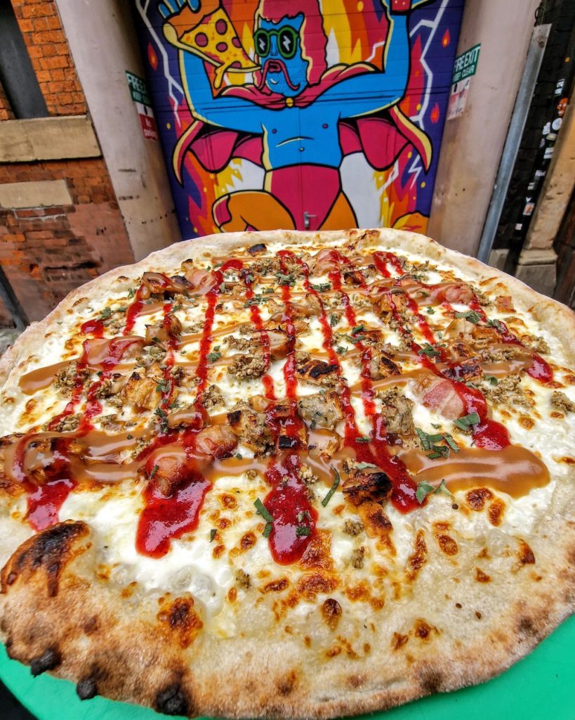 A pizza topped with a red sauce at Crazy Pedro's in Liverpool