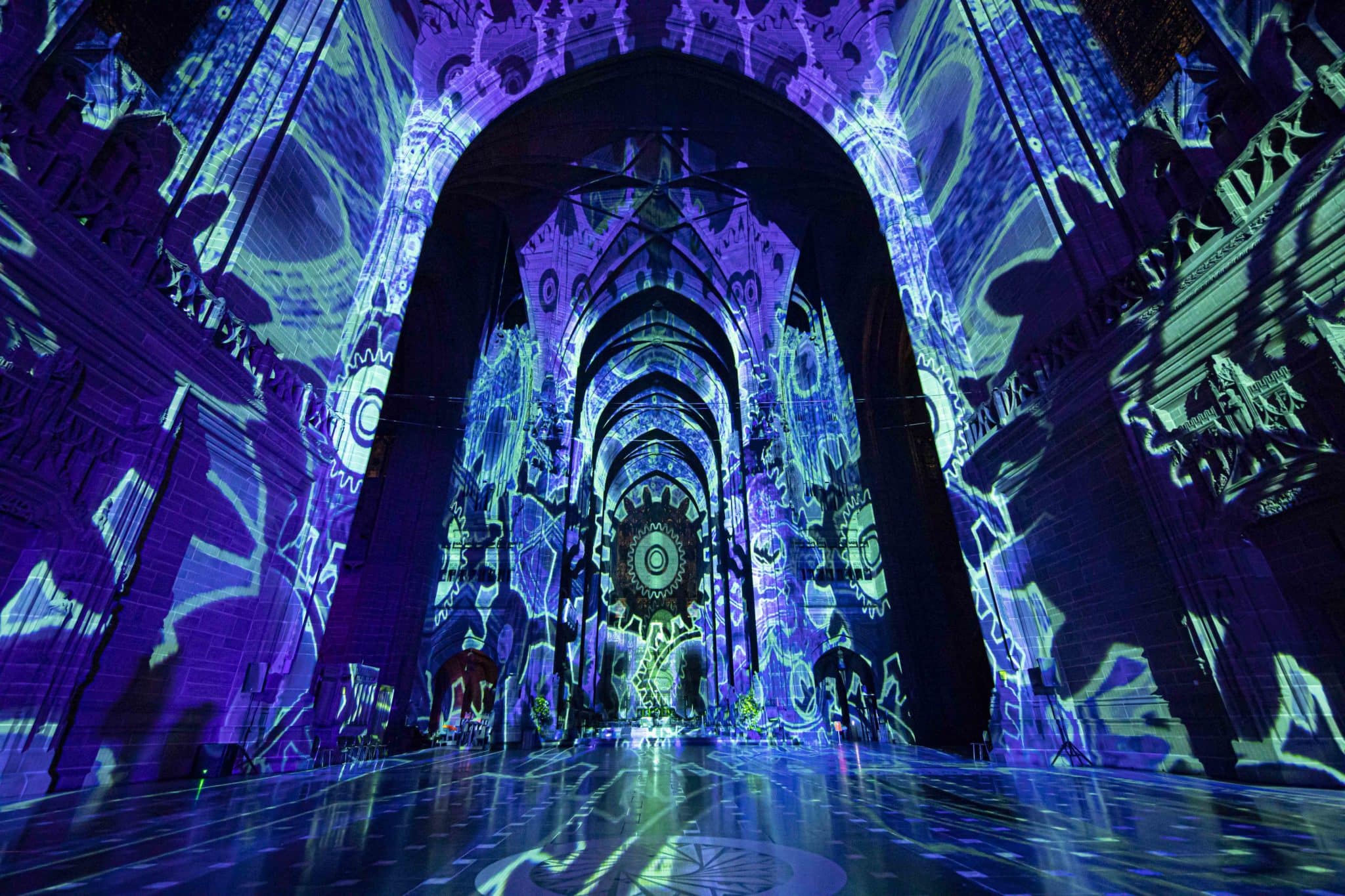 Liverpool cathedral illuminated by blue lights at 'The Light Before Christmas: The Angels Are Coming'