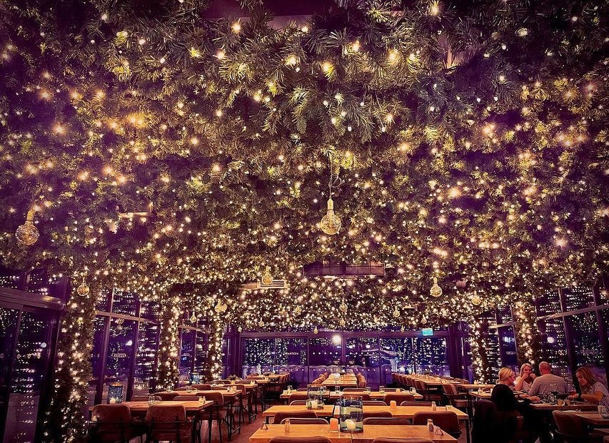 A restaurant with 50,000 illuminates baubles on the ceiling at 14 Bar & Grill.
