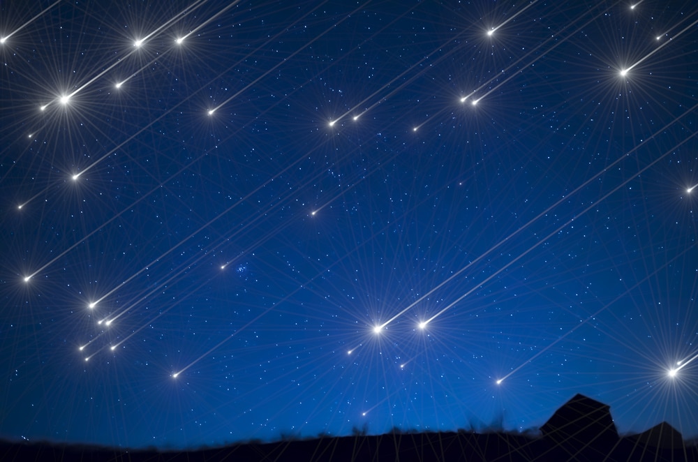 A meteor shower illuminated a dark blue sky.