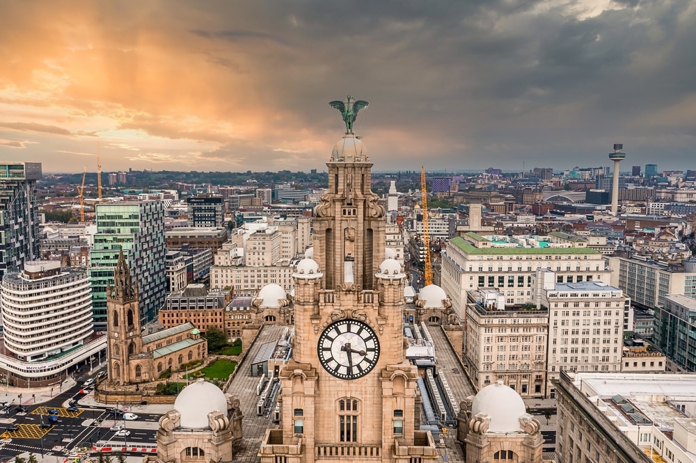 An aerial view of Liverpool with the Royal Liver Building as the central focus.