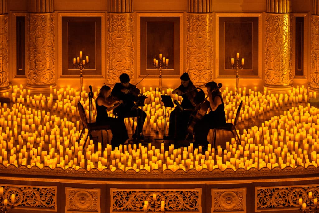 A string quartet play at a Candellight Concert in St. George's Hall. 