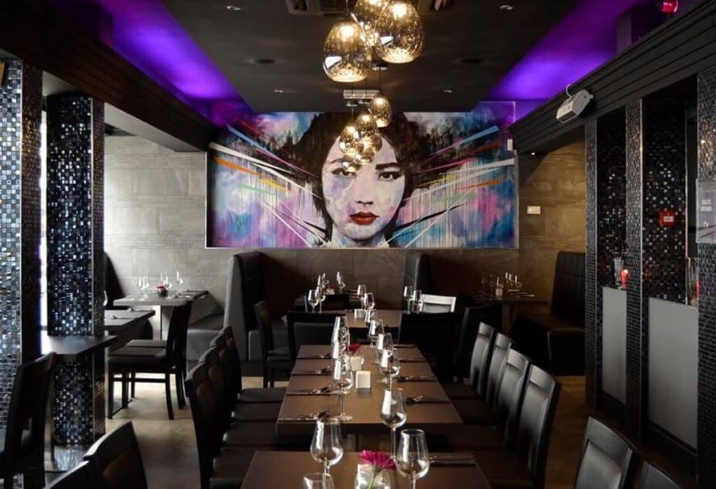 Dining room at Chy with mural in Liverpool