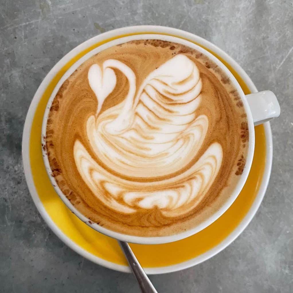 Latte art of a swan from Bean There Coffee Shop in Liverpool